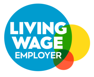 The image features overlapping colorful circles with bold white text stating Living Wage Employer across the largest blue circle.