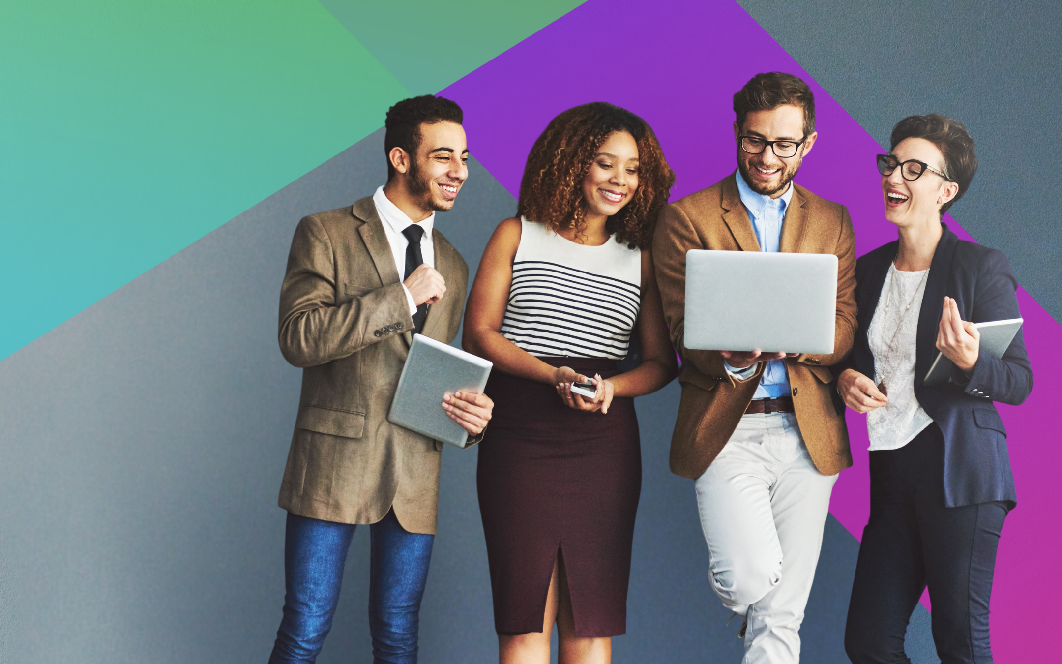 Four professionally dressed people stand together smiling, looking at a laptop and tablet, against a modern, colorful geometric background. They appear to be collaborating or discussing something positive.