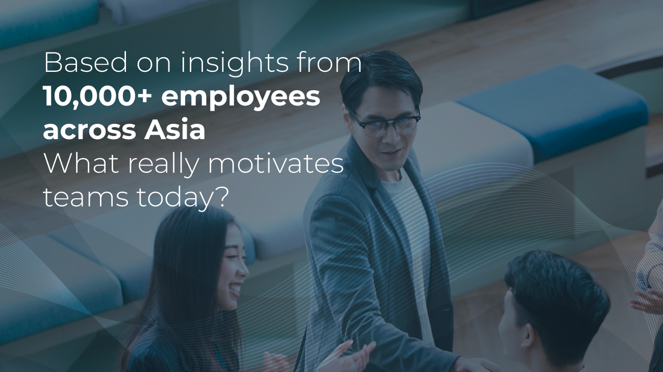 A man in glasses shakes hands with a smiling woman in a modern office. Text reads: Based on insights from 10,000+ employees across Asia. What really motivates teams today?.