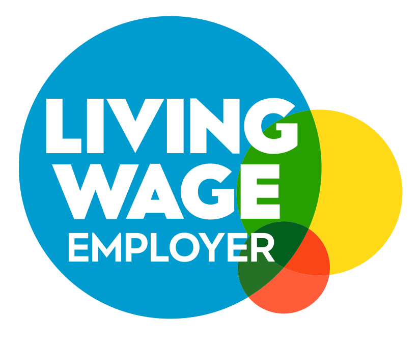 A logo with overlapping blue, yellow, green, and orange circles. Bold white text in the blue circle reads LIVING WAGE EMPLOYER.