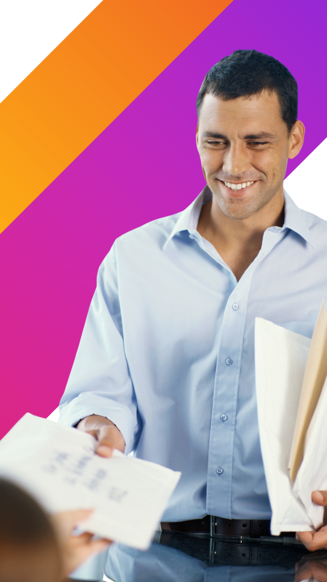 A man in a light blue shirt smiles while handing over envelopes. He holds more envelopes under his arm. The background features orange and purple diagonal stripes.