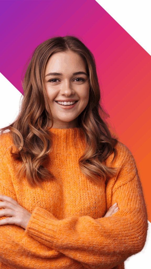 A young woman with long, wavy brown hair, wearing an orange sweater, stands with her arms crossed, smiling in front of a pink and orange gradient geometric background.