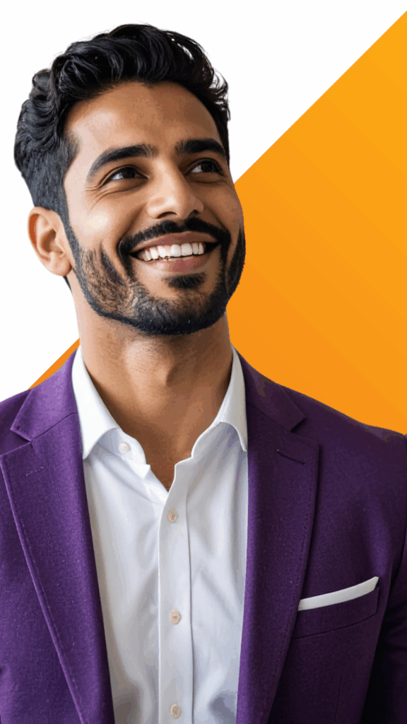 A smiling man in a purple suit jacket and white shirt stands in front of a white and orange geometric background.