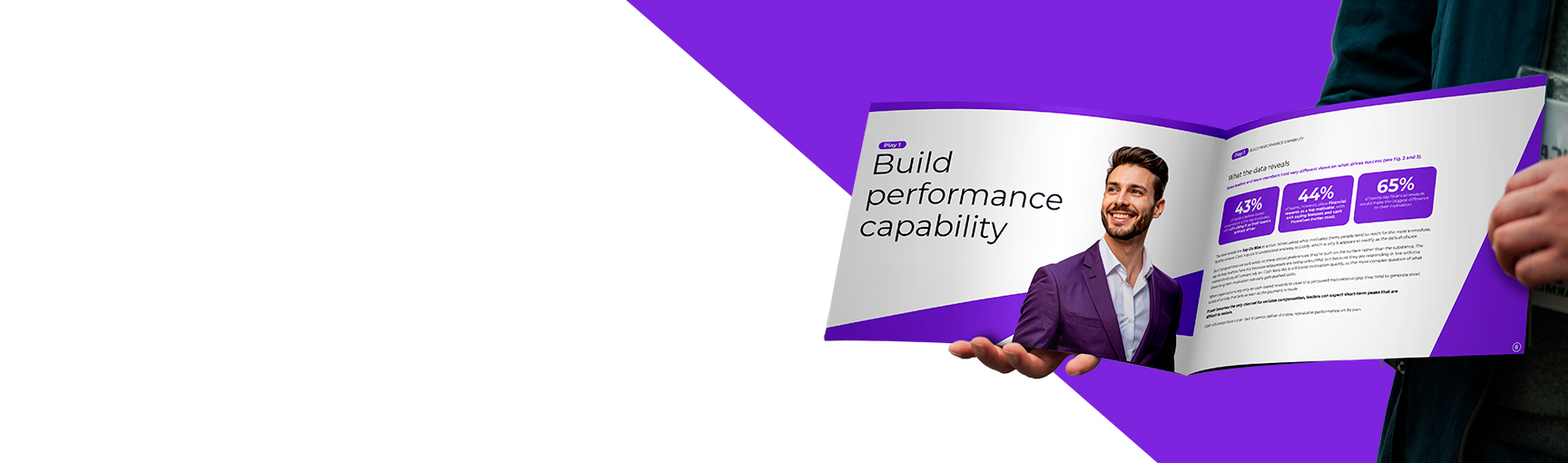 A person in a suit holds an open brochure with a purple and white design. The visible page shows a smiling man in a purple jacket and the text “Build performance capability.”.