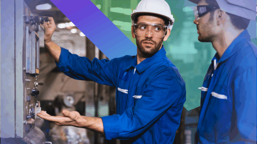 Two workers wearing blue coveralls, white helmets, and safety glasses operate machinery in an industrial setting. One points to a control panel while the other listens attentively. A colorful gradient overlays part of the image.