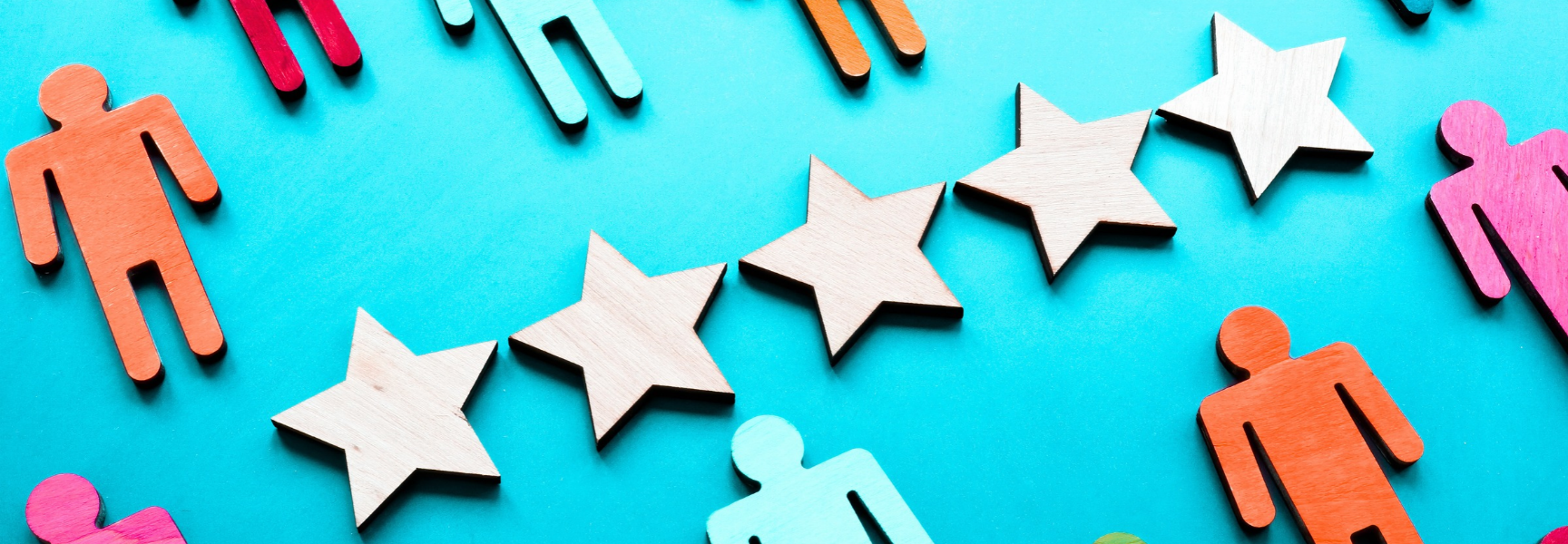 Colourful wooden human figures and five wooden stars are arranged on a blue background, symbolising rating, teamwork, or customer satisfaction.