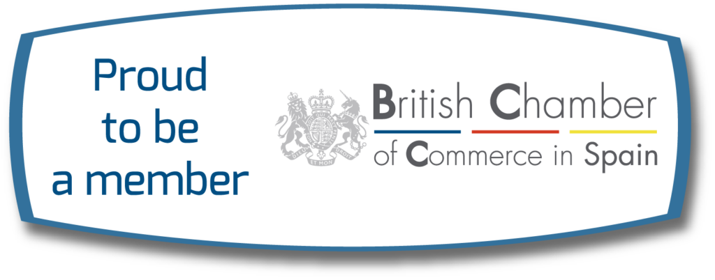 Logo stating Proud to be a member beside the British Chamber of Commerce in Spain logo, which features coloured lines and the UK coat of arms.