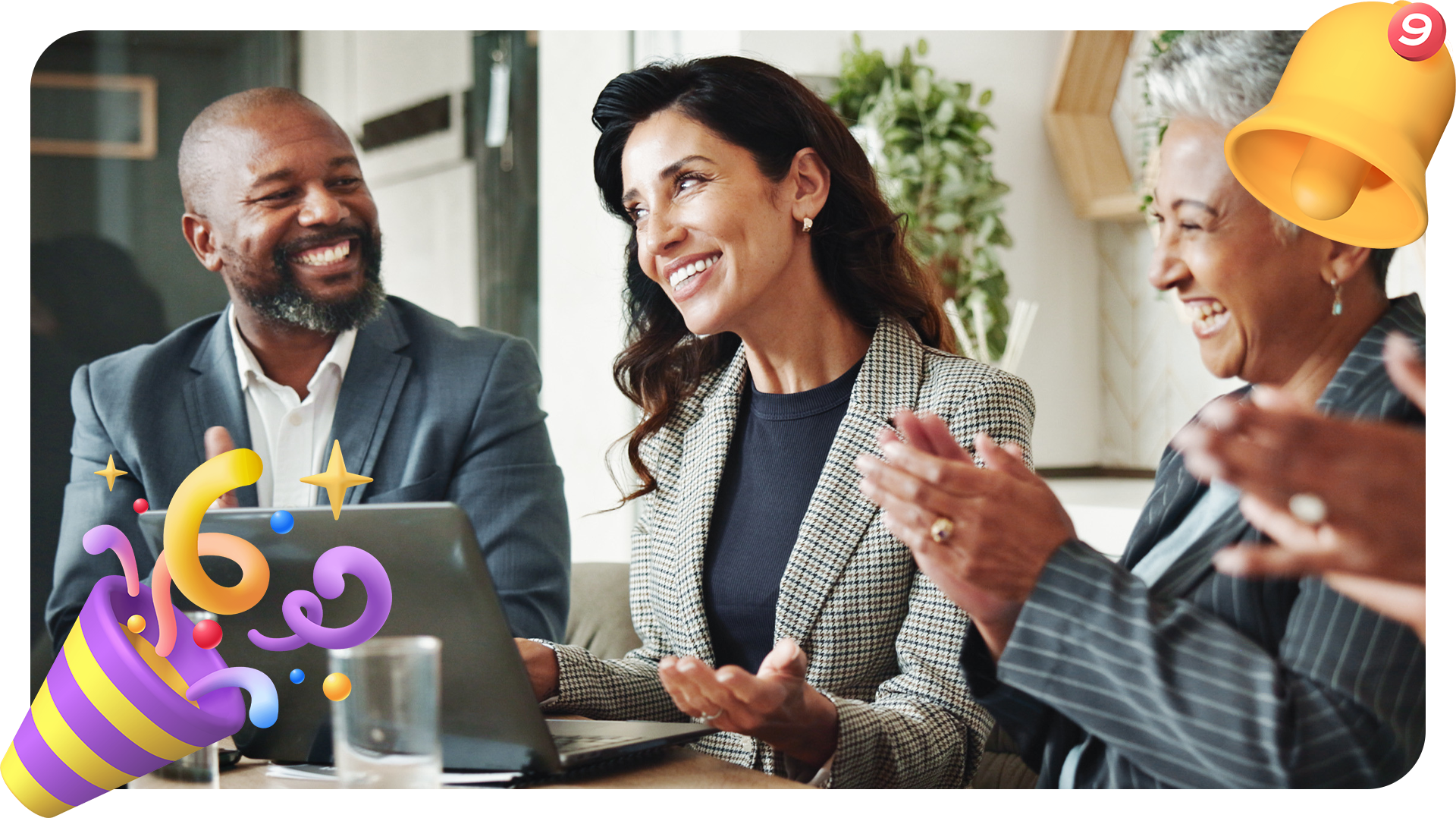 Three colleagues in business attire sit at a table, smiling and clapping during a meeting. Festive confetti and party emojis are overlaid, creating a celebratory atmosphere.