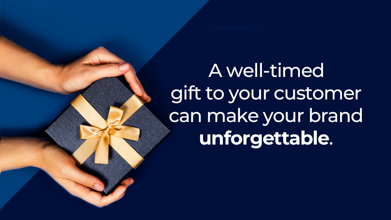 Two hands hold a dark gift box with a gold ribbon. Next to it, white text on a blue background reads: A well-timed gift to your customer can make your brand unforgettable.