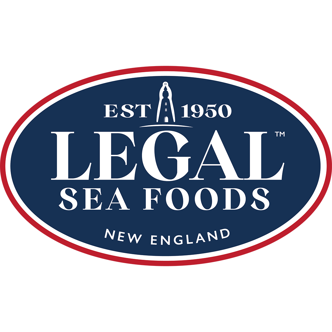 Legal Sea Foods logo. Navy blue oval with red and white border reads: EST 1950 LEGAL SEA FOODS NEW ENGLAND. A lighthouse icon replaces the A in LEGAL..